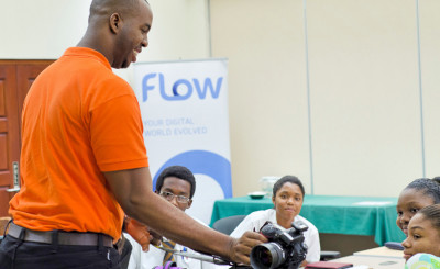 BrightPath facilitator Juma Bannister, left, leads eager young participants in a hands-on Digital Photography session at BrightPath's TechLink Barbados workshop, Cave Hill School of Business, June 21. Photo courtesy The BrightPath Foundation.