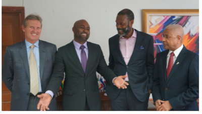 CAPTION: Cable and Wireless Communications CEO Phil Bentley, Minister of Science, Energy and Technology Andrew Wheatley, FLOW Managing Director Garfield Sinclair and FLOW Foundation Executive Chairman Errol Miller during a meeting at the ministry on May 11, 2016. PHOTO COURTESY Jamaica Ministry of Science, Energy and Technology.